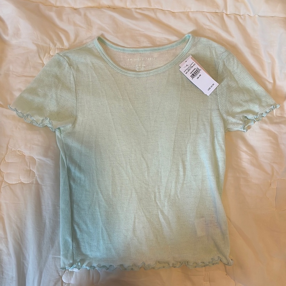 American Eagle turquoise baby tee shirt.